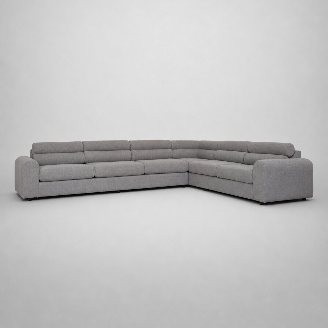 A modern light gray fabric sectional sofa with a low-profile, blocky design,